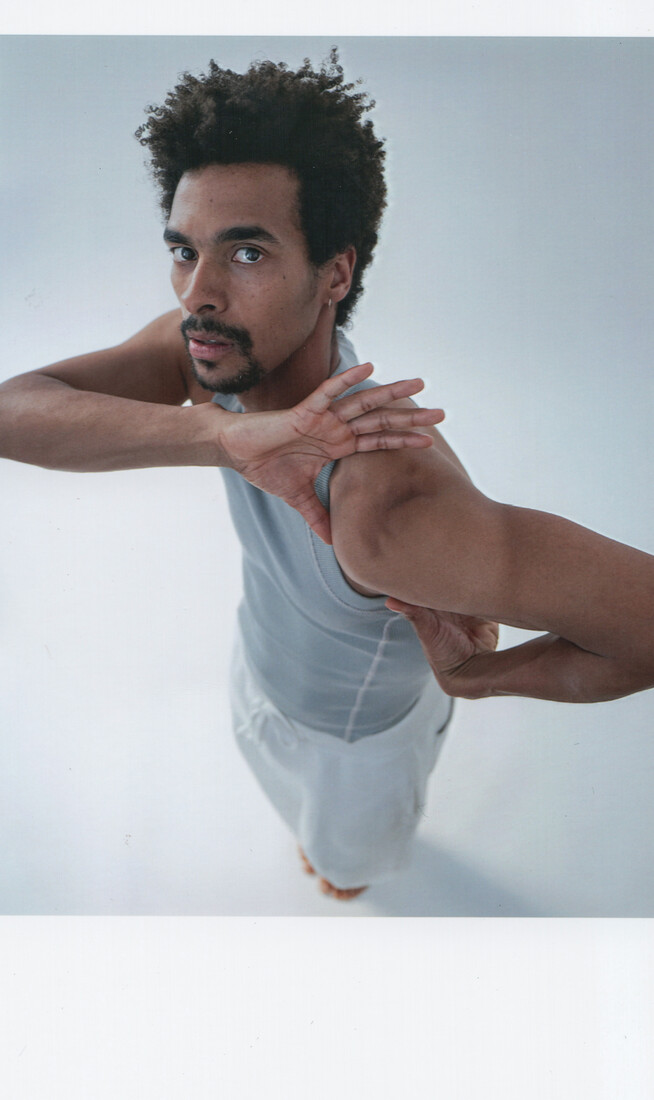 A collage of three images of a male dancer, showing him looking at the camera, then surrounded by fragmented photos of his hands