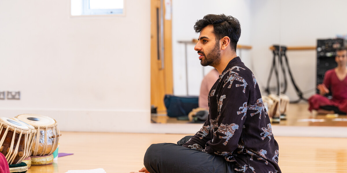 Shyam Dattani sat cross-legged while talking