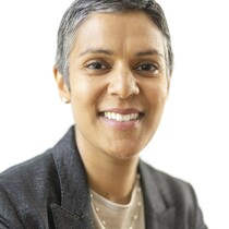 Portrait of Eva Sarma, a woman with short hair