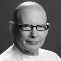 Image of Anthony van laast. Anthony wears thick glasses. This is a black and white image.